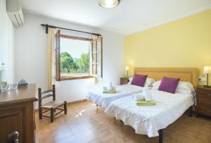 Posteľ alebo postele v izbe v ubytovaní Owl Booking Villa Tia - Exclusive Holidays