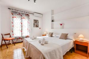 Łóżko lub łóżka w pokoju w obiekcie Villas Guzman Ismael