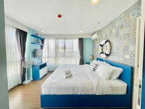 Postel nebo postele na pokoji v ubytování Baan Imm Aim Huahin sea view