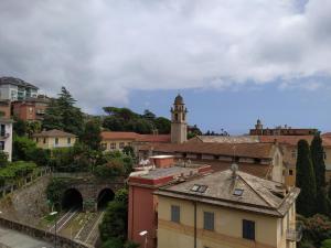a view of a city with a clock tower at Castelletto al mare in Rapallo