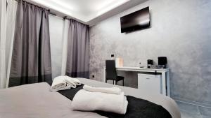 Katil atau katil-katil dalam bilik di Residenza Vittorio 57