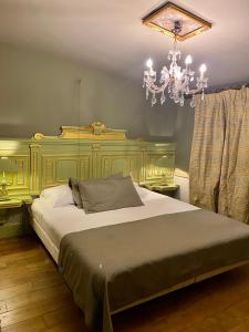 Кровать или кровати в номере sogni d'oro