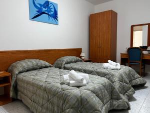 Кровать или кровати в номере Al Saliceto Hotel