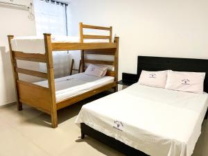 Postel nebo postele na pokoji v ubytování Hotel Acosta Castro