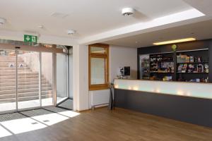 a bar in the lobby of a building at Pontresina Youth Hostel in Pontresina