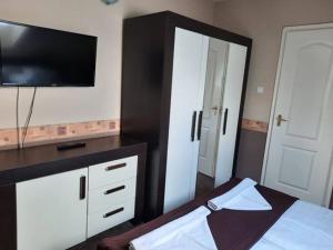 Posteľ alebo postele v izbe v ubytovaní Kék Lagúna Wellness Apartmanok