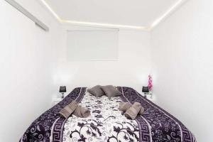 A bed or beds in a room at Manuda Luxury Apartment Még 20 kép