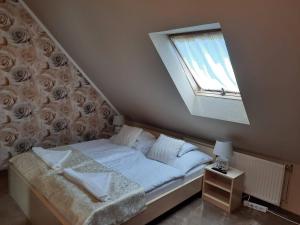 Posteľ alebo postele v izbe v ubytovaní Kék Lagúna Wellness Apartmanok