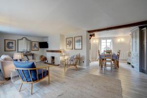 a living room with a couch and a table at Mariners Hard, Cley-Next-The-Sea in Cley next the Sea