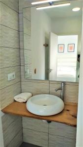 a bathroom with a white sink and a mirror at Benlloch Silence in Valencia