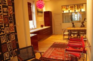 a kitchen and dining room with a table and chairs at High End Budapest in the city center in Budapest