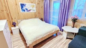Кровать или кровати в номере Муражье Делюкс