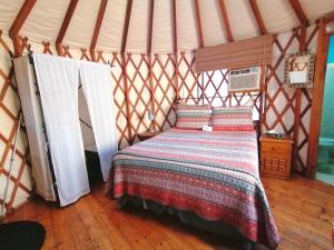 Cama ou camas em um quarto em Sukasa Bungalows