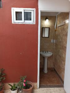 a bathroom with a sink and a window at Apart termas in Termas de Río Hondo +20 photos
