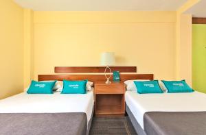 Cama o camas de una habitación en Hotel Suites Marne