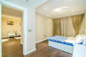 a bedroom with a bed and a living room at Port Baku Hotel Twixroom in Baku +26 photos