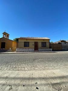 an empty street in front of a building at Casa grande Campestre, Vicuña, Valle del Elqui in Vicuña