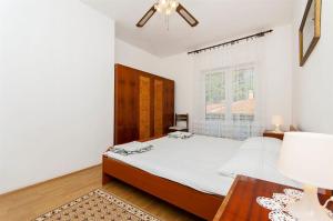 Postel nebo postele na pokoji v ubytování Apartment Nedjeljka