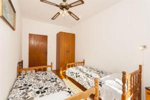 Postel nebo postele na pokoji v ubytování Apartment Nedjeljka