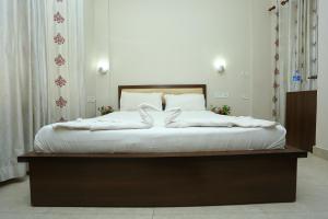 Ένα ή περισσότερα κρεβάτια σε δωμάτιο στο Hotel Innate Inn