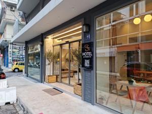 a store front with a large window at Hotel @Syngrou Fix in Athens