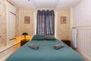 Llit o llits en una habitació de Le 03-GregIMMO-Appart'Hôtel