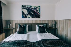 Postel nebo postele na pokoji v ubytování Hotel De Kalvaar