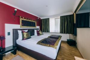 Postel nebo postele na pokoji v ubytování Hotel De Kalvaar