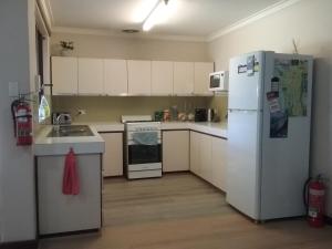 
A kitchen or kitchenette at Maggie's Family Retreat

