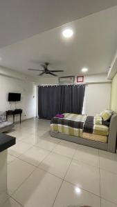 a bedroom with a bed and a ceiling fan at Staycity Apartment - D'Perdana Sri Cemerlang in Kota Bharu