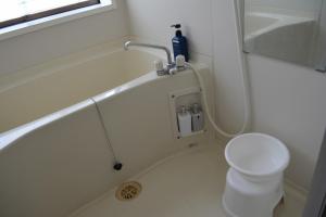 a bathroom with a tub and a toilet and a sink at Amakusa - House / Vacation STAY 5321 in Amakusa