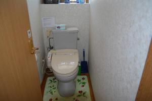 a small bathroom with a toilet in a stall at Amakusa - House / Vacation STAY 5321 in Amakusa