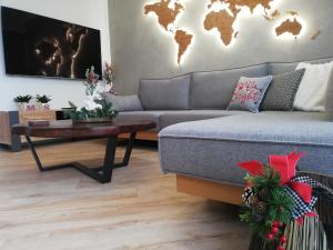 a living room with a couch and a table at Luxury 80m2 apartment with balcony downtown Thessaloniki in Thessaloniki