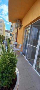 a balcony of a building with a bench on it at Angel apartament in Sibiu