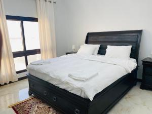 Кровать или кровати в номере Alhama Hotel Appartment