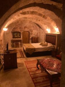 Postel nebo postele na pokoji v ubytování Monte Cappa Cave House
