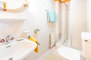 a bathroom with a sink and a toilet and a shower at Haus Suban in Längenfeld +65 photos