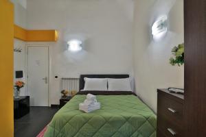 Letto o letti in una camera di Rome Place
