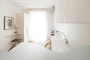 Posteľ alebo postele v izbe v ubytovaní Hotel Ligure