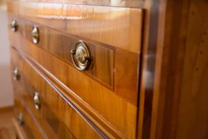a close up of a wooden chest of drawers at Appartement Isabella in Bezau