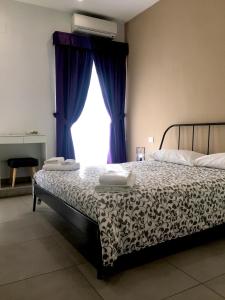 Llit o llits en una habitació de "Panoramic Terrazza - Napoli"