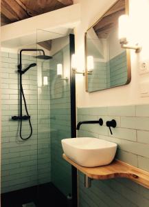 a bathroom with a sink and a shower at Penamacor Cozy Nook House in Penamacor