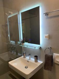 a bathroom with a sink and a shower and a mirror at Corall apartment Bar in Bar +13 photos