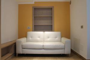 a white chair in a room with a window at Pedrin's House in Livigno