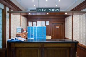 a reception room with blue boxes on a counter at Perla Sun Beach Hotel - All Inclusive in Primorsko