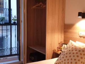 Postel nebo postele na pokoji v ubytování Norte Oviedo Rooms Madrid