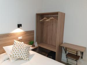 Postel nebo postele na pokoji v ubytování Norte Oviedo Rooms Madrid
