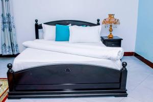 Postel nebo postele na pokoji v ubytování Oxymos Homes