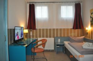 TV a/nebo společenská místnost v ubytování Parkhotel Schwedt