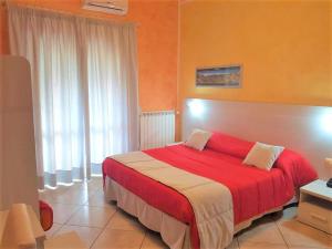 A bed or beds in a room at Il Laghetto